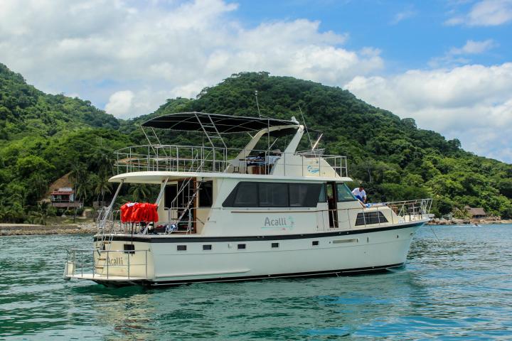 a boat is docked next to a body of water