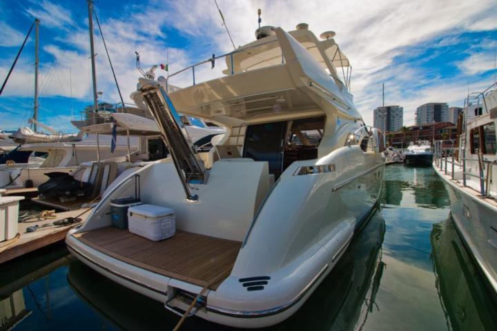 a boat is docked next to a body of water