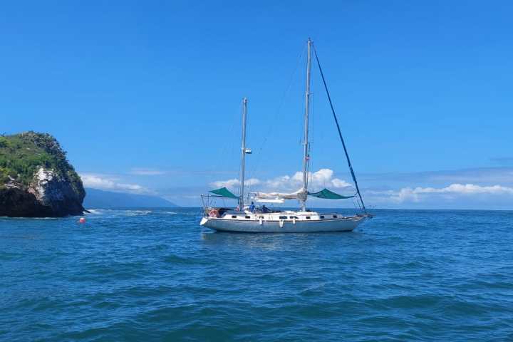 a small boat in a large body of water