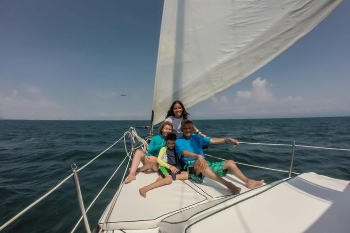 a person riding on the back of a boat in the water